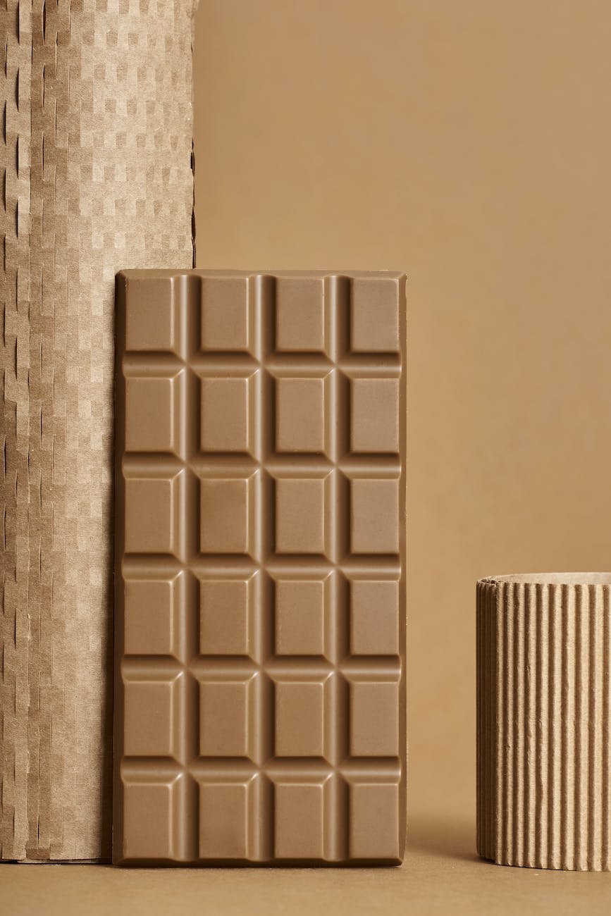 chocolate bar placed near carton in studio